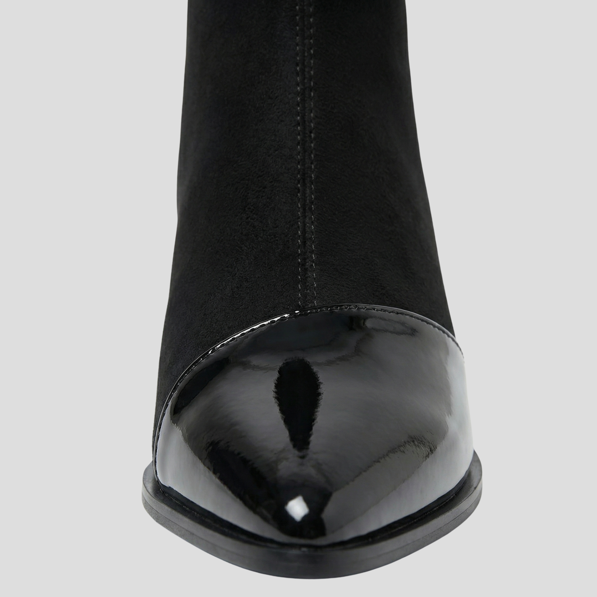 Women's ankle-height boots with contrast detail, shown in black and brown