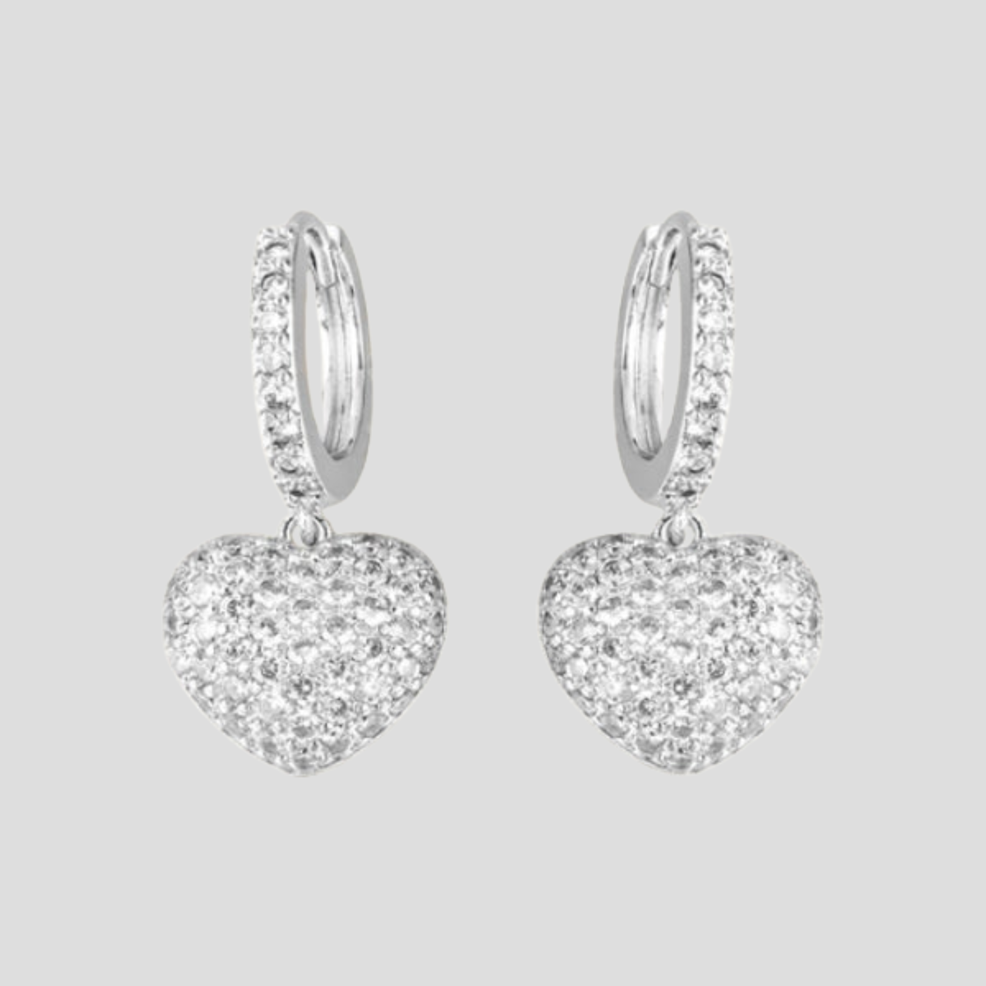 Heart charm pavé drop earrings shown in gold and silver finishes