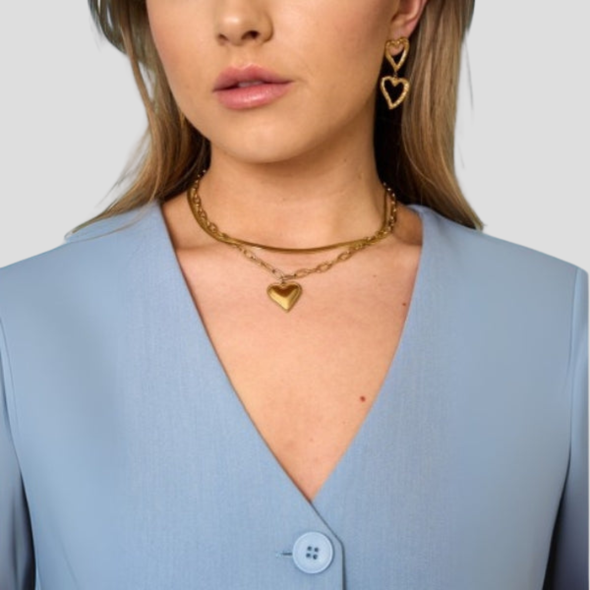 Gold-tone heart pendant necklace with a bold link chain silhouette