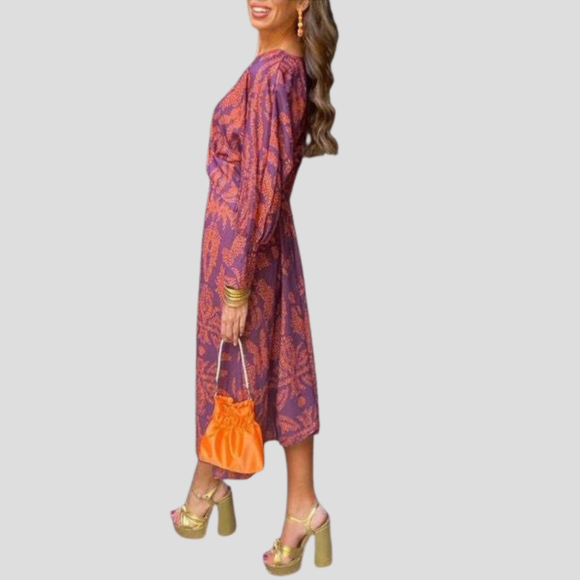 Women's flowing midi dress with defined waist shown in blue, green, red and purple