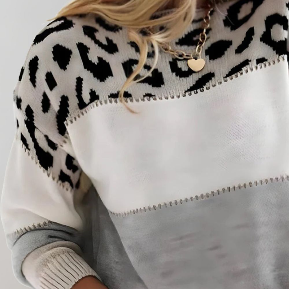 Woman's warm classic knit jumper shown in grey and pink