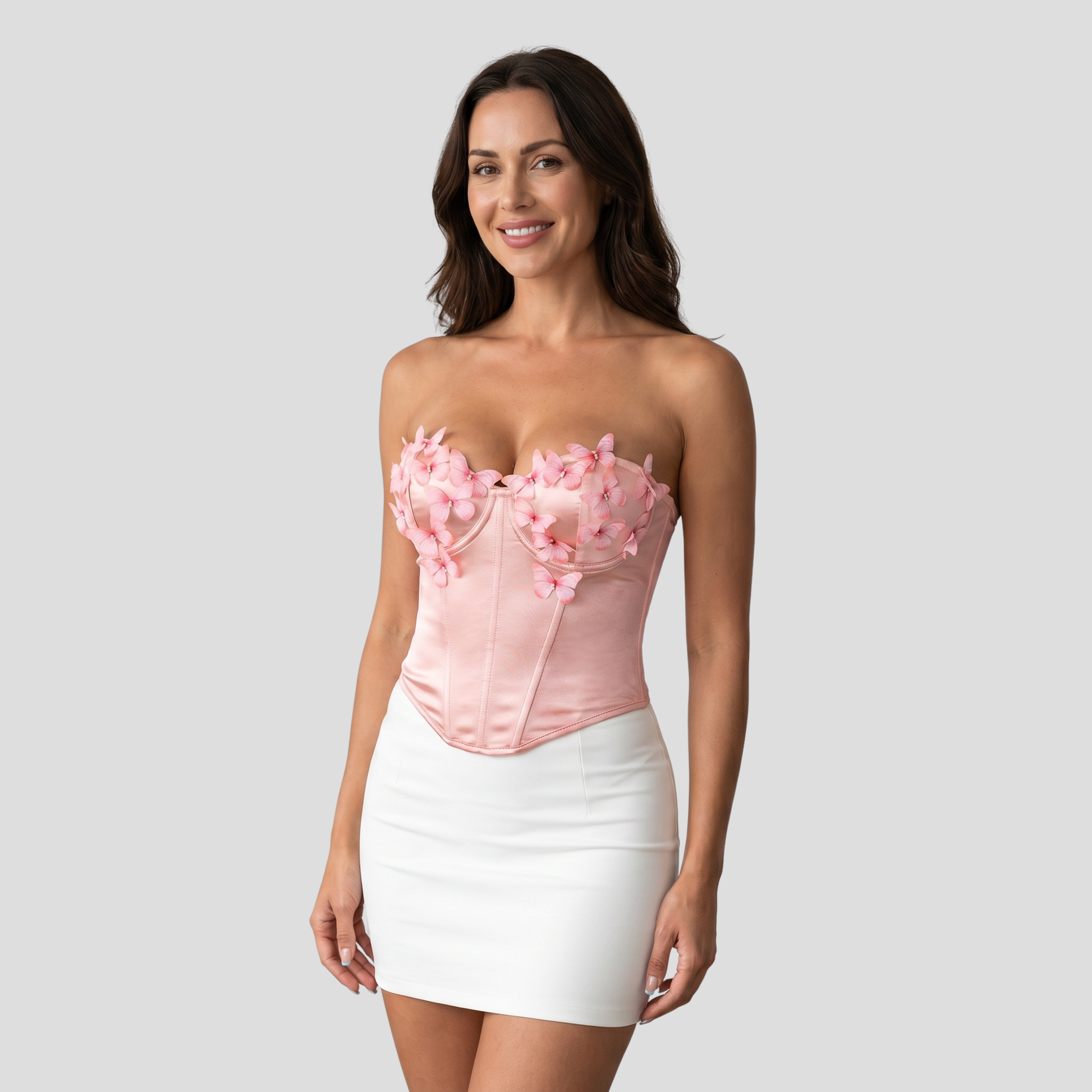 Strapless corset-style top with sweetheart neckline and 3D floral appliqué detail