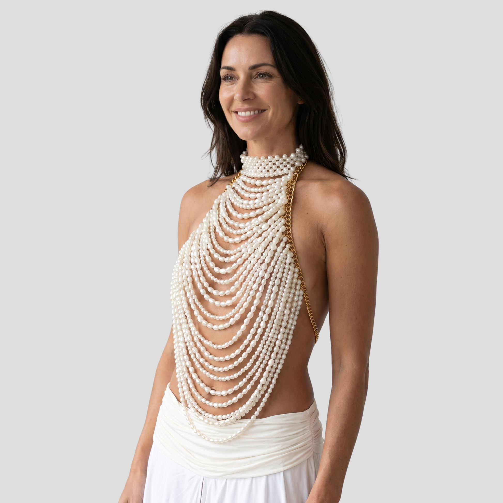 White beaded halter top with cascading bead detail and draped lines for occasion wear