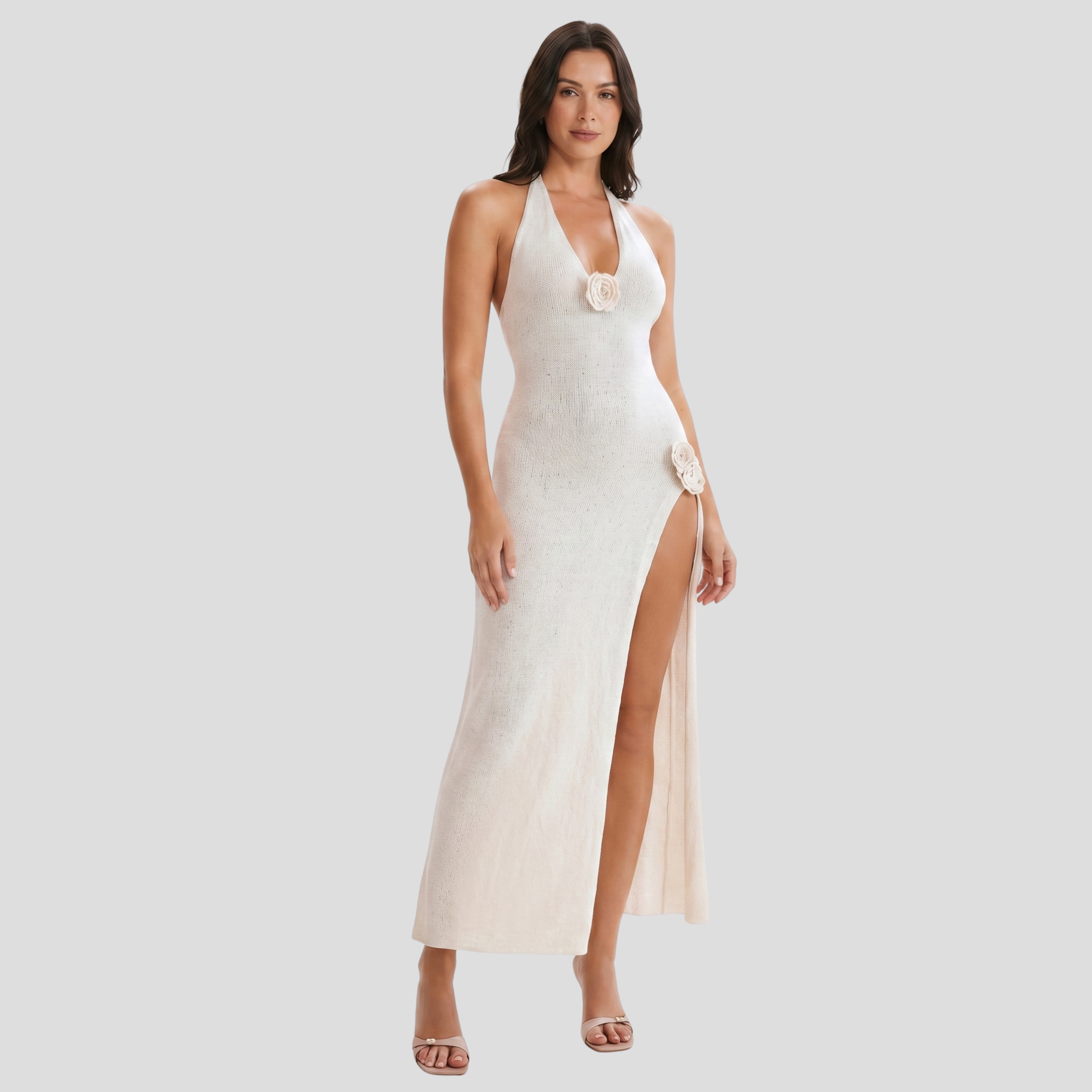 White halter neckline maxi dress with floral appliqué detail and side slit