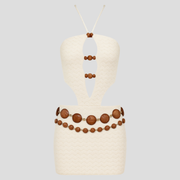 White women's mini dress with cut-out detailing and bead accents