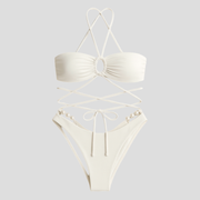 White women's bikini set with pearl details and wrap-tie top and bottom