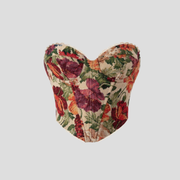 Women's orange floral corset top with scalloped edges and fitted silhouette