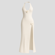 White halter neckline maxi dress with floral appliqué detail and side slit