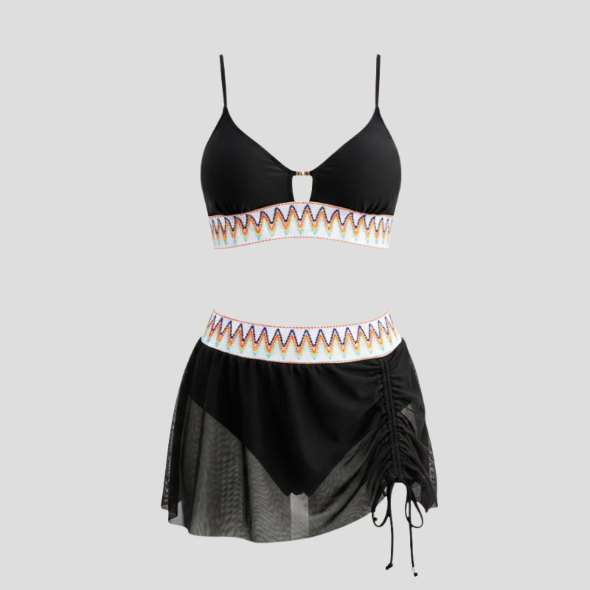 Women's three-piece swimwear set with embroidered waistband, metallic detail, and sheer tulle skirt