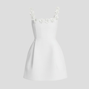 White mini dress with square neckline and floral shoulder strap details