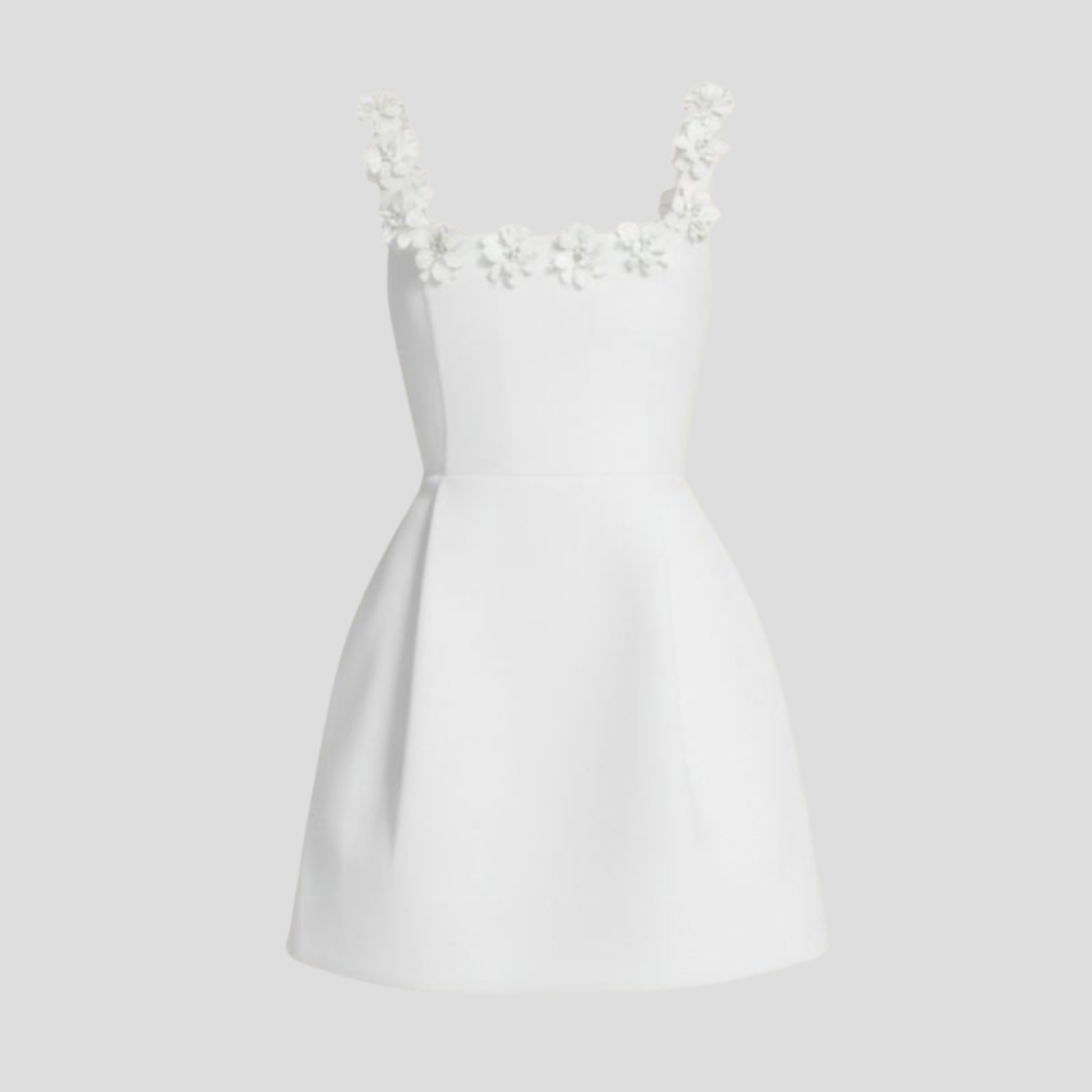White mini dress with square neckline and floral shoulder strap details