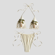 Women's beige cream triangle bikini set with palm-inspired embellishments and adjustable ties
