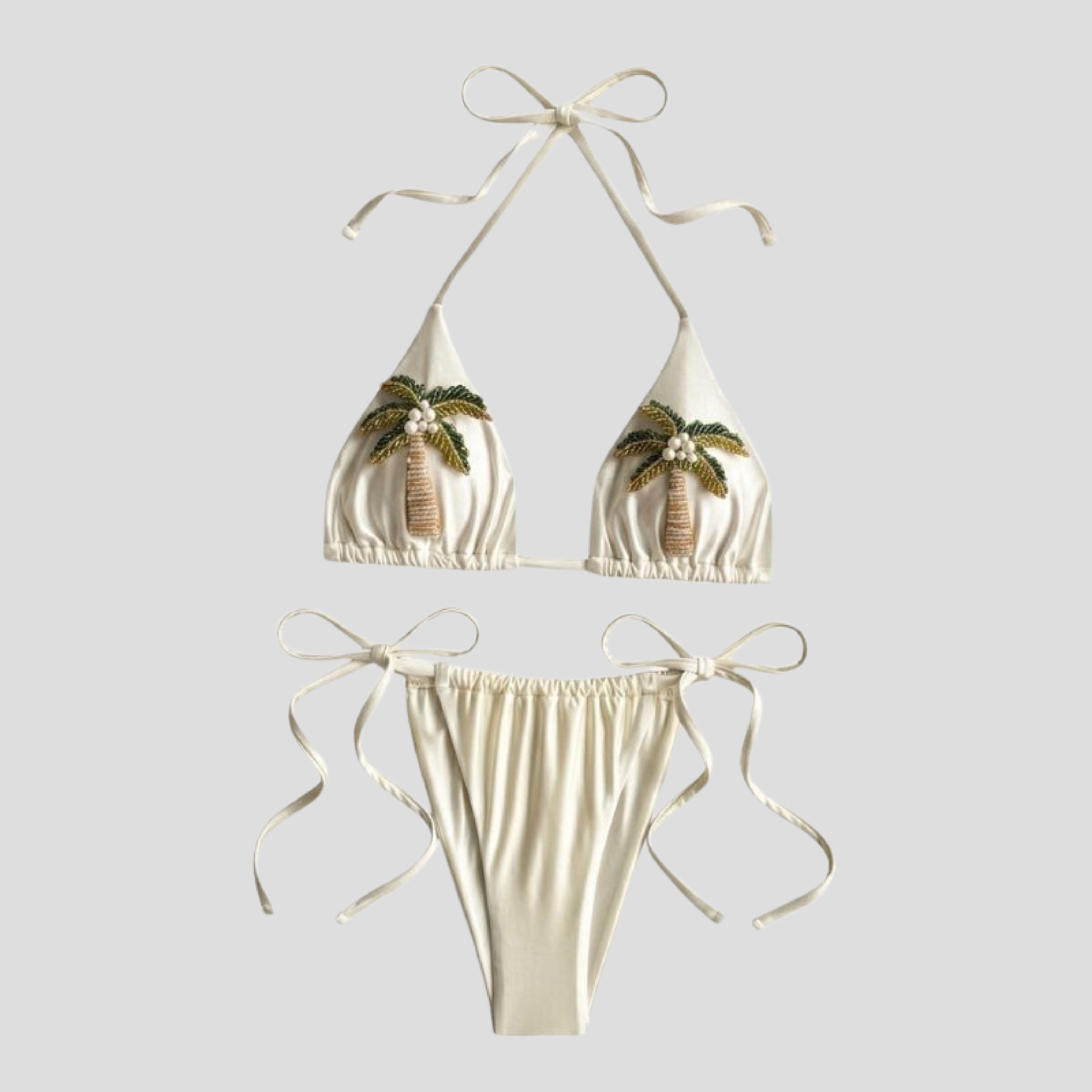 Women's beige cream triangle bikini set with palm-inspired embellishments and adjustable ties
