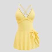 Women's V-neck one-piece swim dress with side-tie skirt and cross-back straps