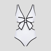 White one-piece swimsuit with front bow detail, side cut-outs and contrast piping