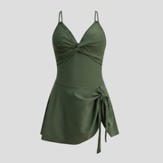 Women's twist-front one-piece swimsuit with skirted overlay and crossover back