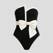 Black strapless one-piece swimsuit with a statement bow across the upper front
