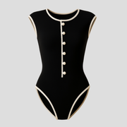 Black one-piece women's swimsuit with button-front detail and contoured silhouette