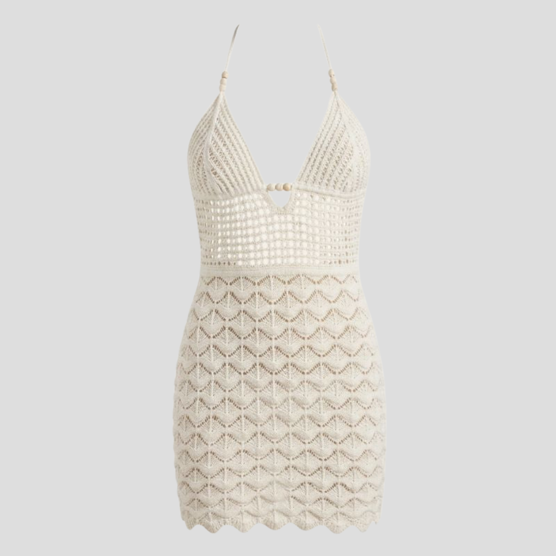 White halter neckline mini dress with open-back detail and scalloped hem