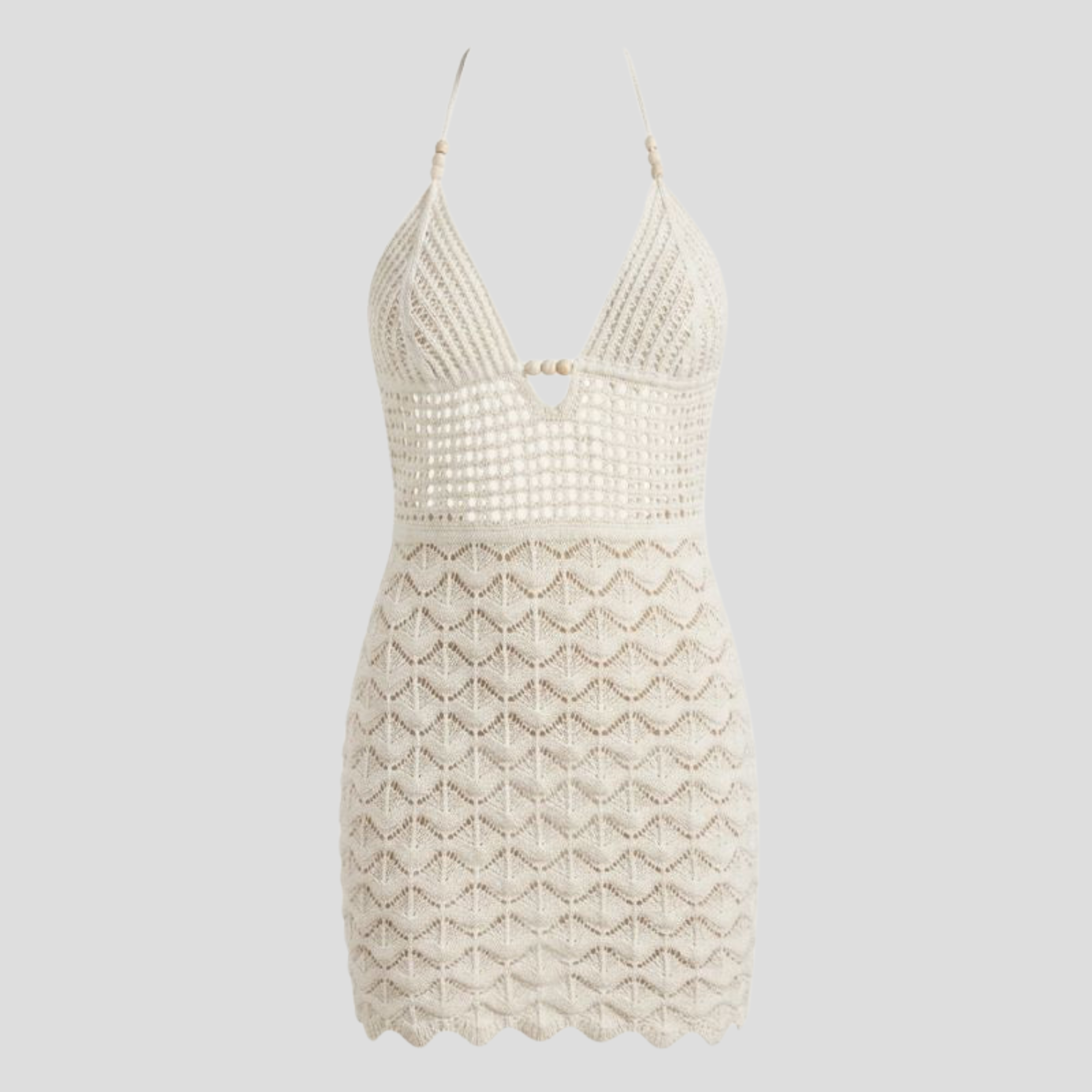 White halter neckline mini dress with open-back detail and scalloped hem